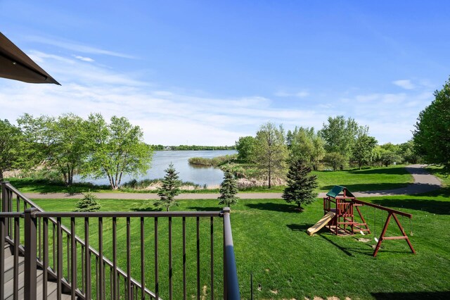 6644 Lamplight Dr, Albertville, MN 55301 - view of green lawn with a water view and a playground