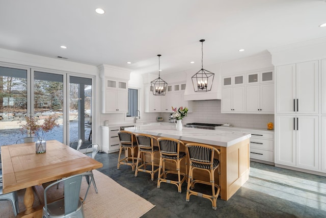 4898 County Road 6, Independence, MN 55359 - kitchen featuring a chandelier, decorative backsplash, a center island, a sink, and custom exhaust hood