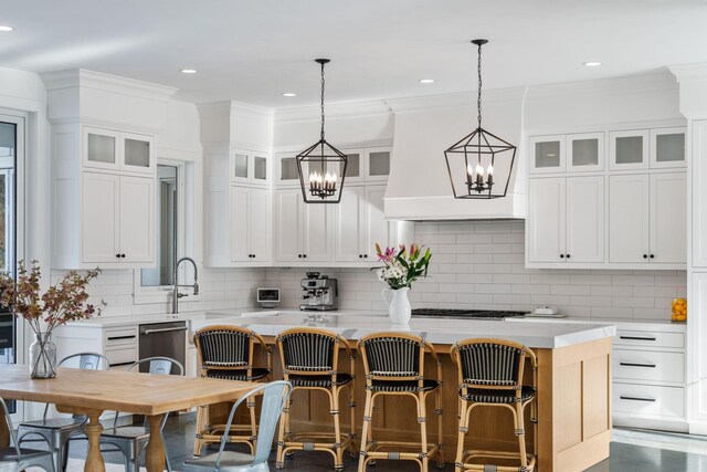 4898 County Road 6, Independence, MN 55359 - kitchen featuring light countertops, a chandelier, tasteful backsplash, white cabinets, and ornamental molding