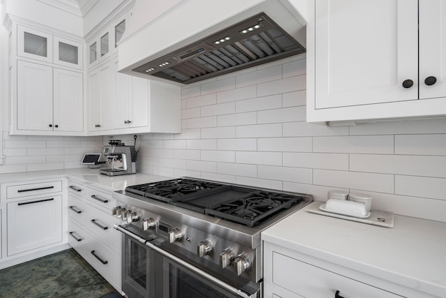 4898 County Road 6, Independence, MN 55359 - kitchen with range with two ovens, custom range hood, decorative backsplash, light countertops, and white cabinetry