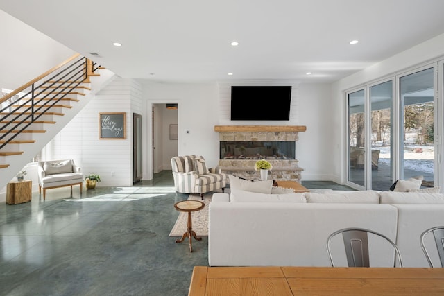 4898 County Road 6, Independence, MN 55359 - living area featuring stairs, recessed lighting, a glass covered fireplace, baseboards, and concrete floors