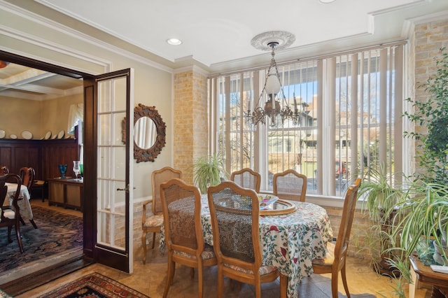 dining space featuring a chandelier, ornamental molding, french doors, and recessed lighting