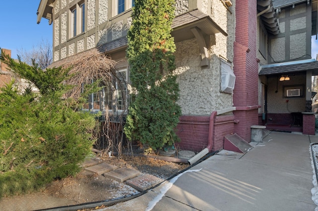 view of property exterior with brick siding