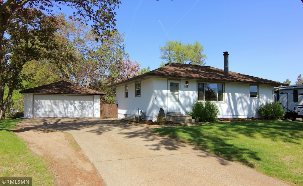 1104 Greystone Ave N, Oakdale, MN 55128 - ranch-style home with a detached garage, an outdoor structure, and a front yard
