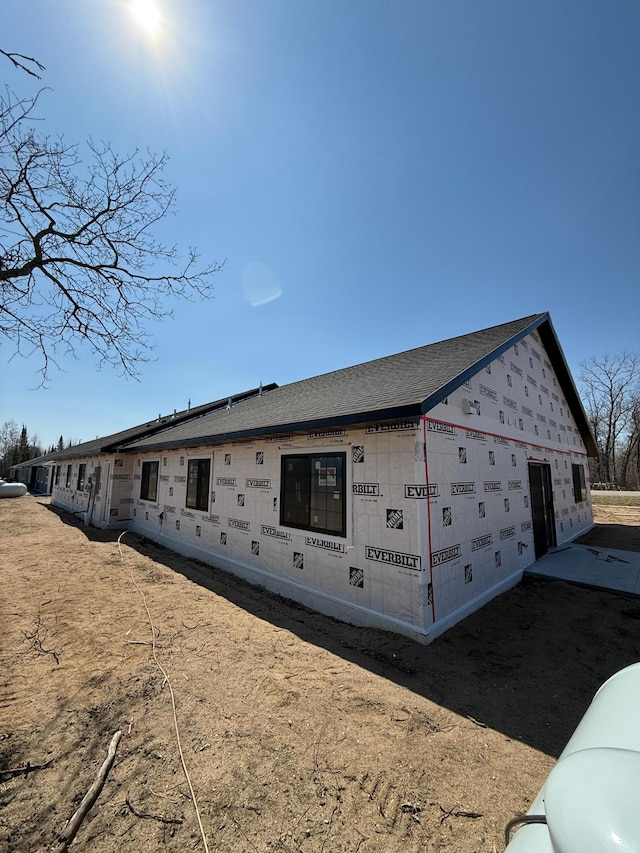 6809 Hamilton Park NW Unit 11, Bemidji, MN 56601 - view of side of property with a shingled roof
