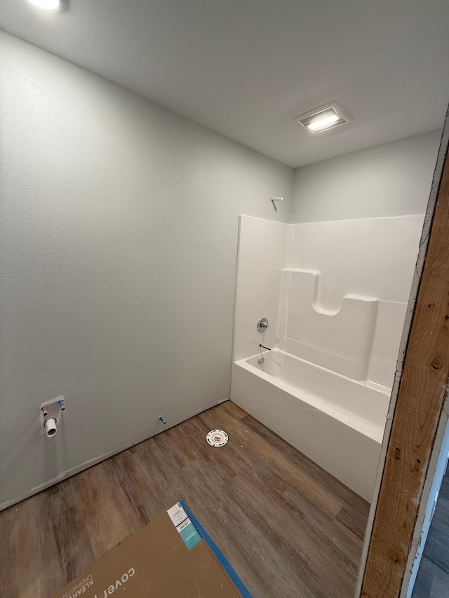 6809 Hamilton Park NW Unit 11, Bemidji, MN 56601 - bathroom with wood finished floors and washtub / shower combination