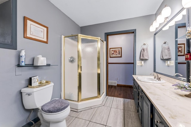 23677 County Road 23, Winona, MN 55987 - bathroom featuring a stall shower, vanity, toilet, and baseboards