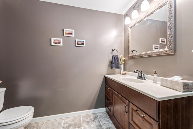 23677 County Road 23, Winona, MN 55987 - bathroom with baseboards, toilet, and vanity