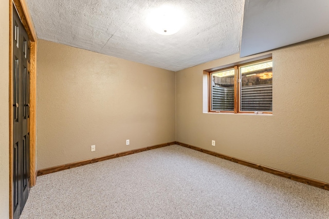 23677 County Road 23, Winona, MN 55987 - carpeted spare room with a textured wall, a textured ceiling, and baseboards