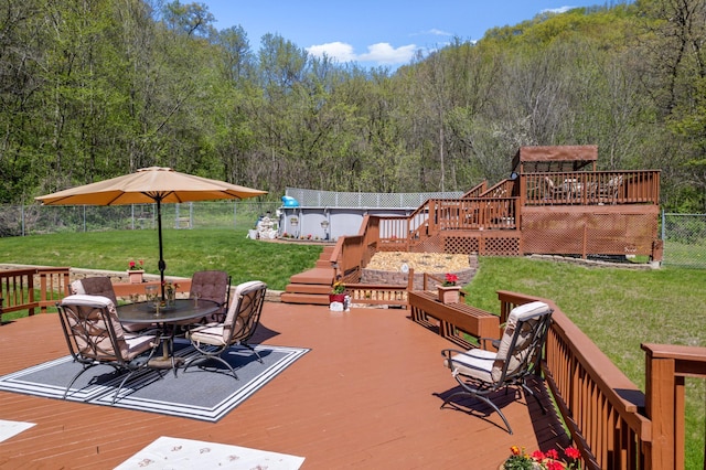 23677 County Road 23, Winona, MN 55987 - deck with outdoor dining space, a wooded view, and stairs