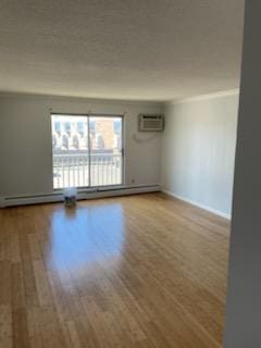 7412 22nd St Unit 204, Saint Louis Park, MN 55426 - empty room with wood finished floors, an AC wall unit, and baseboards