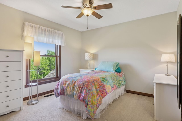 bedroom with baseboards, carpet flooring, and a ceiling fan