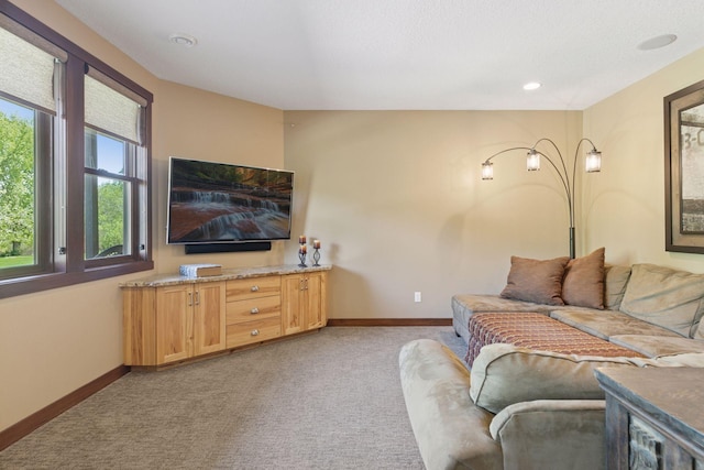 living room with light carpet, baseboards, and recessed lighting