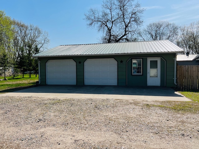 garage with fence