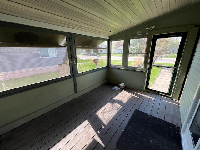unfurnished sunroom with vaulted ceiling and plenty of natural light