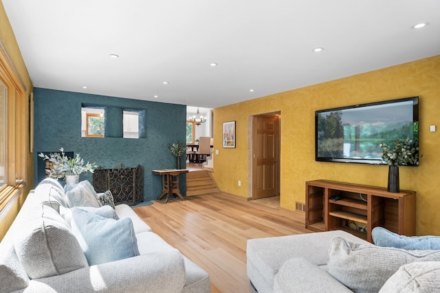 2209 Indian Rd W, Minnetonka, MN 55305 - living area with a chandelier, wood finished floors, recessed lighting, and an accent wall
