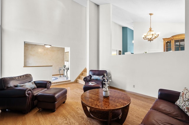 2209 Indian Rd W, Minnetonka, MN 55305 - living room with a chandelier, wood finished floors, a towering ceiling, and stairway