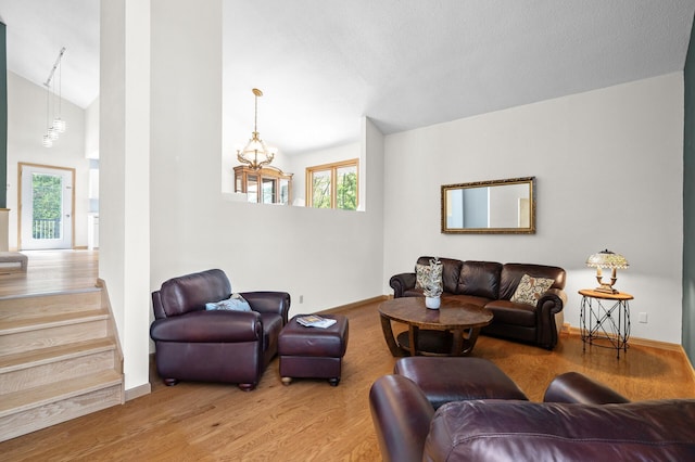 2209 Indian Rd W, Minnetonka, MN 55305 - living area featuring wood finished floors, baseboards, and high vaulted ceiling