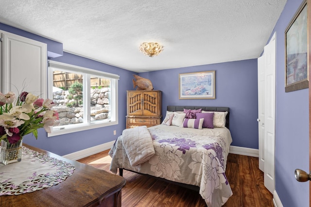 2209 Indian Rd W, Minnetonka, MN 55305 - bedroom with a textured ceiling, baseboards, and wood finished floors