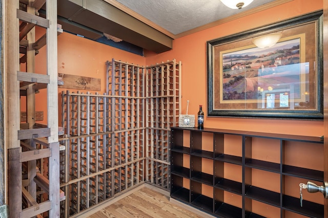 2209 Indian Rd W, Minnetonka, MN 55305 - wine area featuring wood finished floors and a textured ceiling