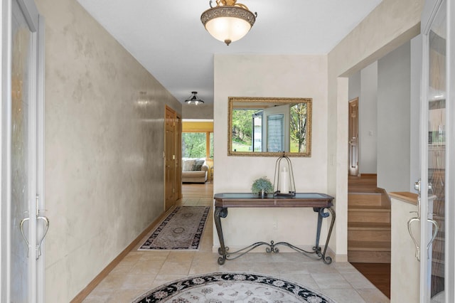 2209 Indian Rd W, Minnetonka, MN 55305 - hallway with baseboards, inlaid floor details, and tile patterned flooring