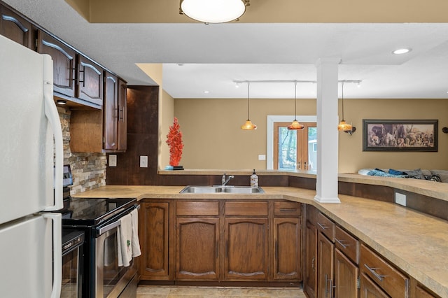 2209 Indian Rd W, Minnetonka, MN 55305 - kitchen featuring freestanding refrigerator, a sink, stainless steel electric stove, hanging light fixtures, and light countertops