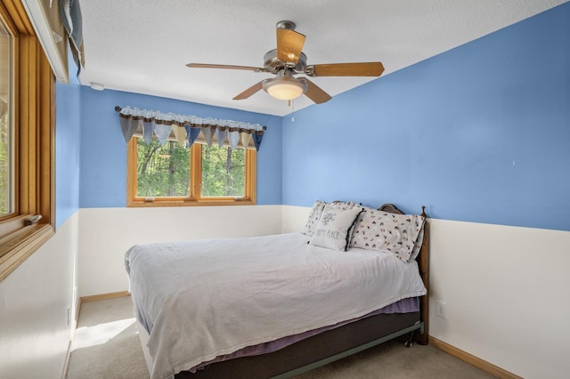 2209 Indian Rd W, Minnetonka, MN 55305 - carpeted bedroom with baseboards and a ceiling fan