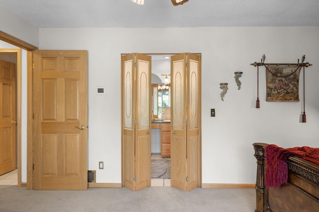 2209 Indian Rd W, Minnetonka, MN 55305 - bedroom featuring light carpet, baseboards, and ensuite bath