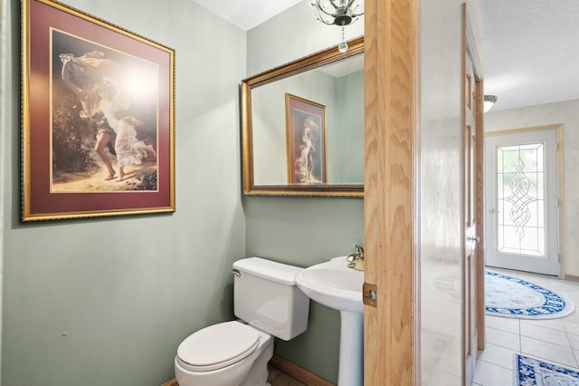 2209 Indian Rd W, Minnetonka, MN 55305 - half bath with toilet, tile patterned flooring, and a sink