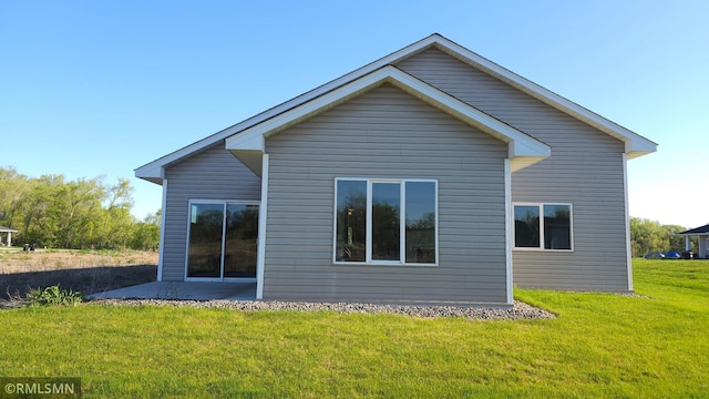 3137 Zuni Way NW, Anoka, MN 55303 - back of property featuring a patio area and a yard