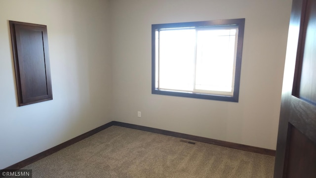3137 Zuni Way NW, Anoka, MN 55303 - spare room with plenty of natural light, carpet, and baseboards