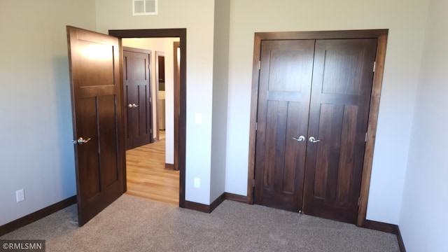 3137 Zuni Way NW, Anoka, MN 55303 - unfurnished bedroom featuring baseboards, carpet flooring, and a closet