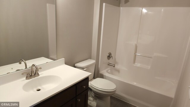 3137 Zuni Way NW, Anoka, MN 55303 - bathroom with toilet, vanity, and tile patterned floors