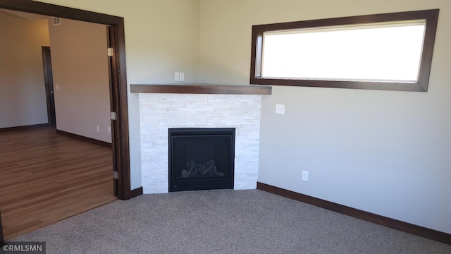 3137 Zuni Way NW, Anoka, MN 55303 - unfurnished living room with baseboards and a fireplace