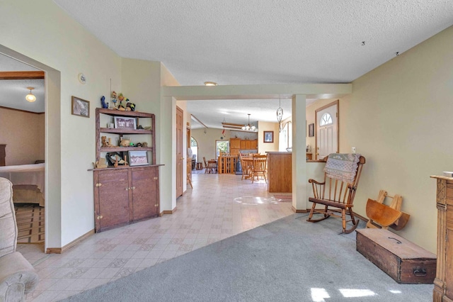 7210 79th Ave SW, Staples, MN 56479 - corridor featuring a chandelier, a textured ceiling, and baseboards