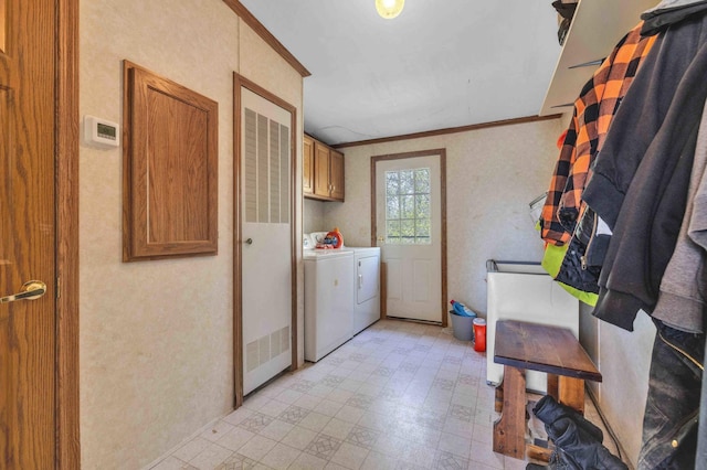 7210 79th Ave SW, Staples, MN 56479 - clothes washing area featuring cabinet space, washer and dryer, light flooring, and crown molding