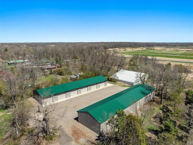 view from above of property with a forest