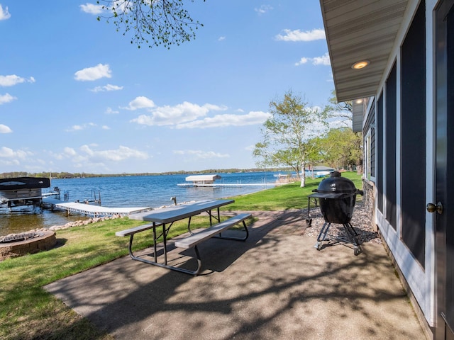 view of community featuring a boat dock and a water view