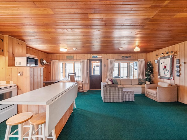 living room with wooden ceiling, wood walls, healthy amount of natural light, and dark colored carpet