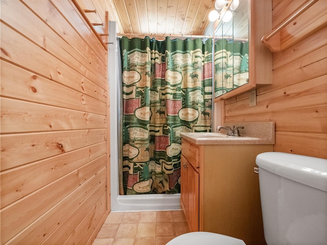 bathroom with toilet, vanity, curtained shower, wood walls, and wooden ceiling