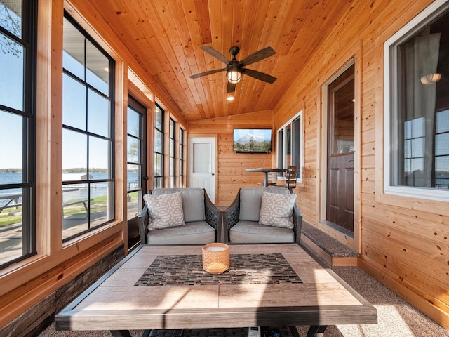 sunroom featuring vaulted ceiling and ceiling fan