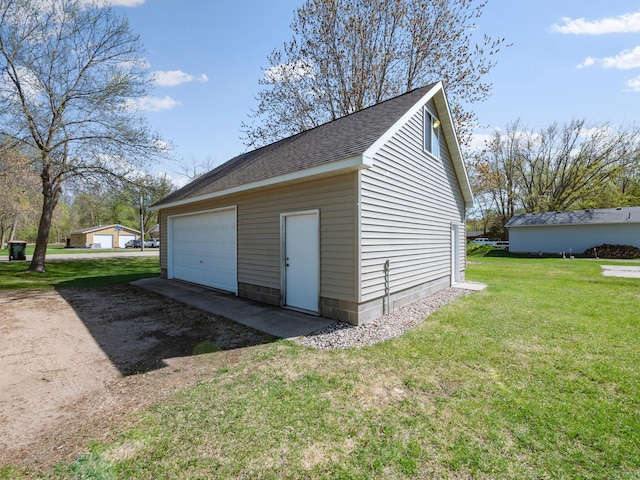 detached garage with dirt driveway