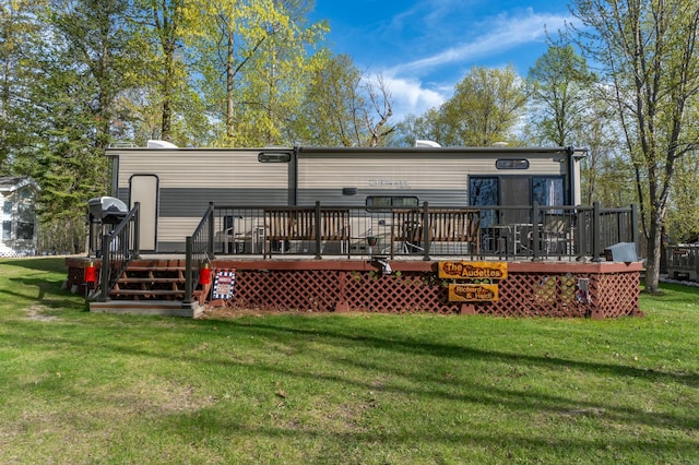 21588 Gull Lake Loop Rd NE Unit 83, Hagali Twp, MN 56683 - back of house with a wooden deck and a yard