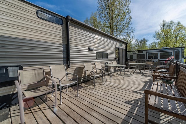 21588 Gull Lake Loop Rd NE Unit 83, Hagali Twp, MN 56683 - wooden terrace featuring outdoor dining area