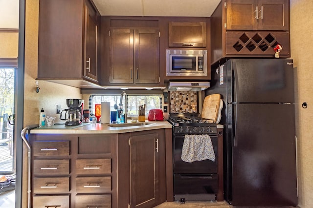 21588 Gull Lake Loop Rd NE Unit 83, Hagali Twp, MN 56683 - kitchen with black appliances, a sink, plenty of natural light, and light countertops