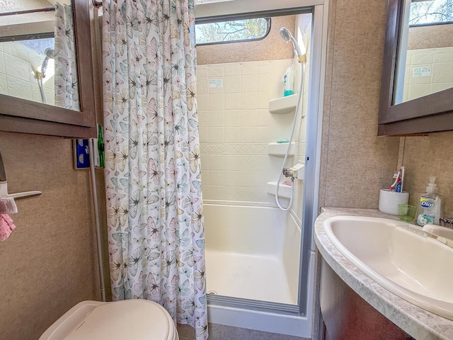 21588 Gull Lake Loop Rd NE Unit 83, Hagali Twp, MN 56683 - bathroom with a shower stall, a sink, and toilet