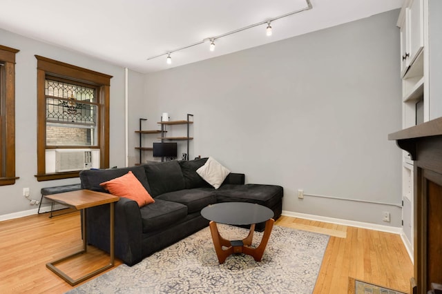 635 Grand Ave Unit 4, Saint Paul, MN 55105 - living room with wood finished floors, rail lighting, and baseboards