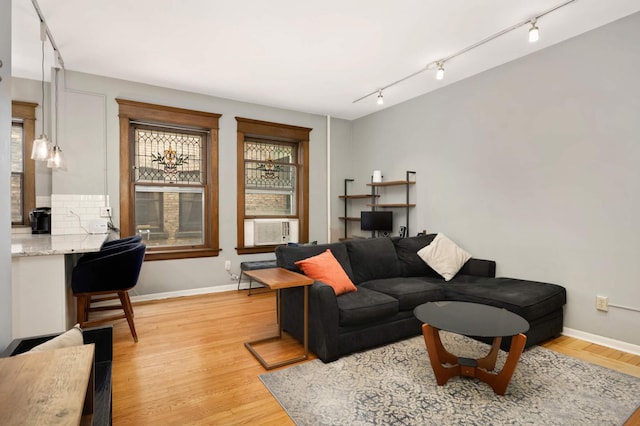 635 Grand Ave Unit 4, Saint Paul, MN 55105 - living room featuring track lighting, light wood finished floors, and baseboards