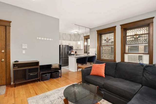 635 Grand Ave Unit 4, Saint Paul, MN 55105 - living area featuring light wood-type flooring, plenty of natural light, and cooling unit