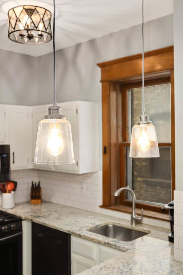 635 Grand Ave Unit 4, Saint Paul, MN 55105 - kitchen with black appliances, a sink, white cabinets, tasteful backsplash, and hanging light fixtures